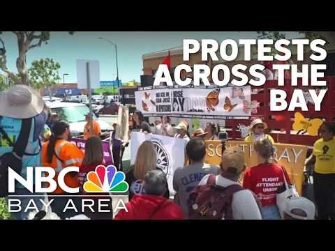 Demonstrators march for worker and immigrant rights in Bay Area May Day protests