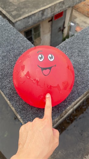 Experiment: Will a water balloon explode if it rolls down a tall building? 💥🎈 #balloon
