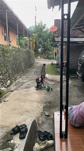 Young Girl Tumbles Off Her Tricycle