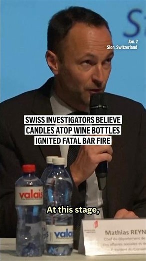 Swiss investigators believe candles atop wine bottles ignited fatal bar fire