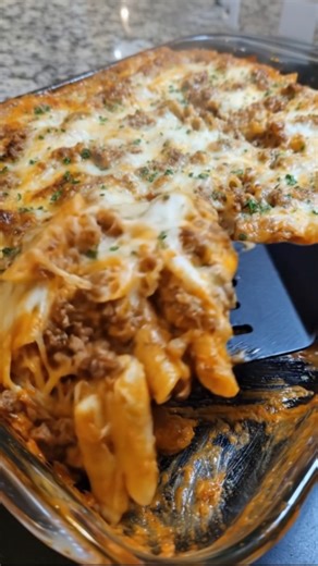 Baked Ziti with Mozzarella & Ricotta This Baked Ziti with Mozzarella & Ricotta is a cheesy, baked pasta classic—layered with a rich tomato meat sauce, creamy ricotta, and loads of gooey mozzarella. It’s cozy, craveable, and perfect for family dinners, feeding a crowd, or stocking the freezer. Ingredients: 1 lb ziti or penne pasta 1 tablespoon olive oil 1 lb ground beef or Italian sausage 1 small onion, diced 2 cloves garlic, minced 1 jar (24 oz) marinara or pasta sauce 1 teaspoon Italian seasoni