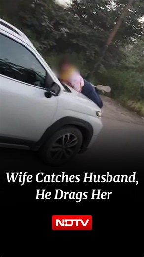 Woman Catches Husband Eating Momo With Girlfriend, He Drags Her On Car Bonnet