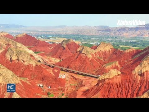 Fuxing train cuts through Danxia landform in Northwest China