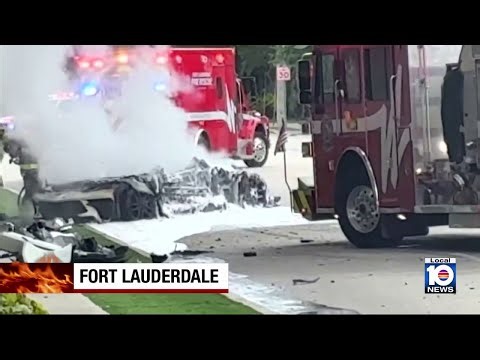 2 people injured after vehicle slammed into tree, caught fire