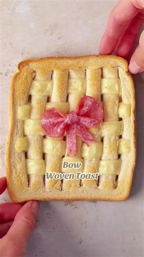 My viral woven toast made extra cute with a salami bow. If you don’t believe your grilled cheese tastes better this way, you need to try it! #woventoast #viralrecipe #viralfood #grilledcheese #salamibow