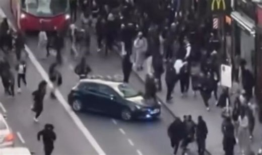 Two arrested after crowds of young people swarm London high street in social media 'flash mob'