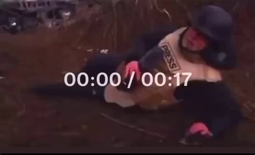 BBC's Chief Correspondent, Jeremy Bowen, pretending to be under Russian attack when an elderly Ukrainian lady walking her dog stops to make sure he's okay