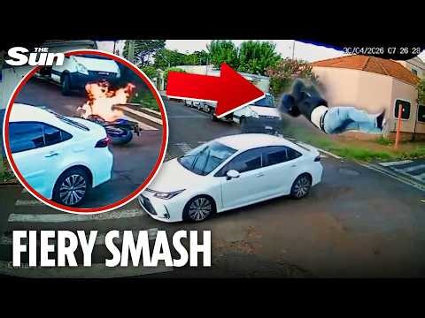 Motorcyclist flies through air as bike bursts into flames after high-speed T-bone crash