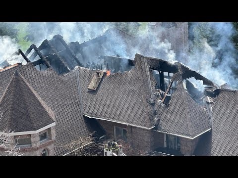 Large fire burns through castle-like home in Cottonwood Heights