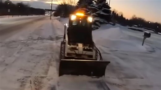 Clearing snow from lots and sidewalks