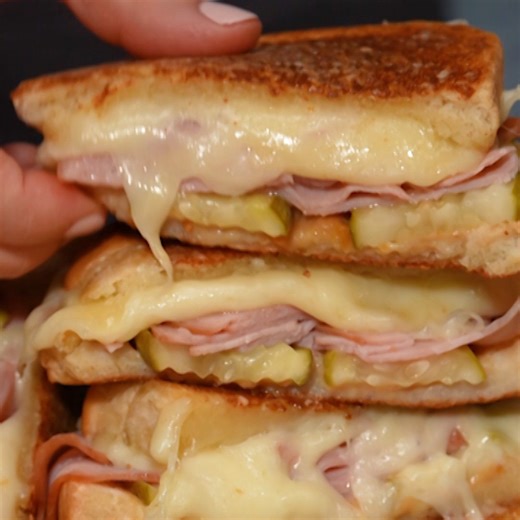 A grilled ham and cheese sandwich is even better when you add a layer of crispy parmesan on the outside. GET THE RECIPE: bit.ly/47QjPB1 | Food & Wine