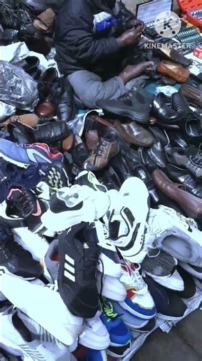 Lot of Shoes & Shoeless Boy....