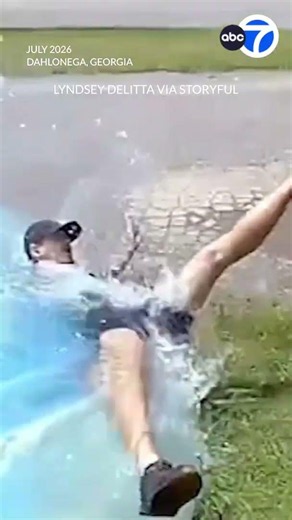 FedEx driver plays it cool after tumbling into pool