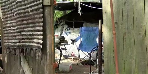 VIDEO: 8 charged after woods fire near I-26 forces road closures, propane tanks explode