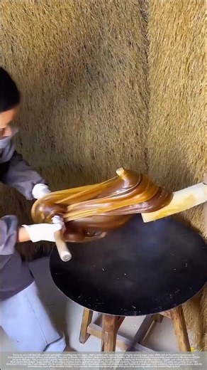 A fleeting moment of traditional sugar art.