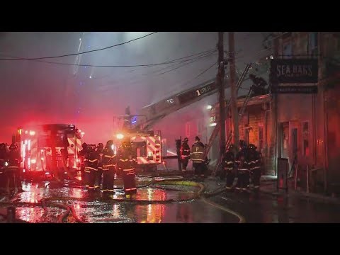 Heavy smoke still coming from Portland Pier, boat owners try to protect boats