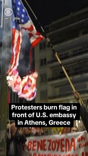 Protesters set fire to a U.S. flag outside the American embassy in Athens, Greece following the capture of Nicolás Maduro and attack on Venezuela's capital. Demonstrators waved Venezuelan and Palestinian flags in front of the embassy and were met by police in riot gear. | CBS News