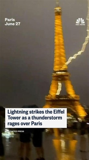 Lightning strikes the Eiffel Tower as a thunderstorm rages over Paris