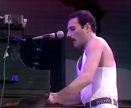 Queen performing "We Are The Champions" at Live Aid in front of 72,000 people in Wembley Stadium, London on the 13th July, 1985.The event was organised by Sir Bob Geldof and Midge Ure to raise funds for the Ethiopian famine disaster.Broadcast across the world via one of the largest satellite link-ups of all time, the concerts were seen by around 40% of the global population.