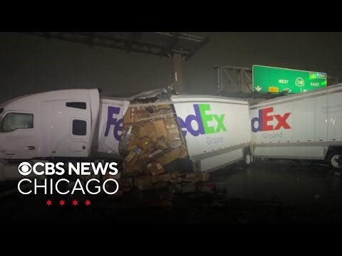 FedEx semi-trailer splits open