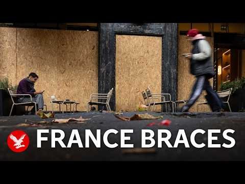Shop owners in France board up windows ahead of weekend protests