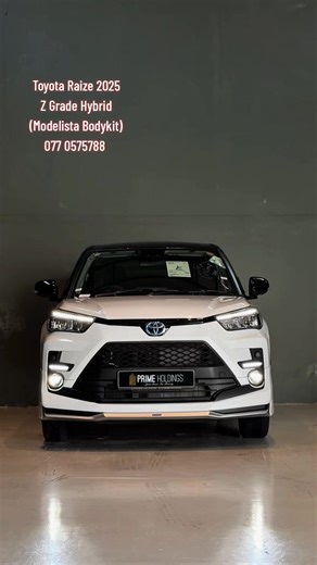 Toyota Raize Z Brand New 2025 Y.O.M:-2025 Fuel:-Petrol/Hybrid Mileage:-Brand New Engine capacity:-1200cc Hybrid Exterior: White/black top, with Factory fitted modelista body kit. Interior: Black Features Virtual cockpit Reverse camera with 360 view. Blind spot mirror SPDL- Drive assist Performance and Eco drive modes Multifunctional steering Seat heaters Apple Carplay/Android Auto HDMI input Keyless entry Power mirrors Adaptive cruise control Lane assist Traction control Auto brake hold function