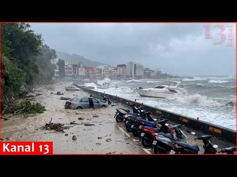 Typhoon Champi uproots trees, capsizes boat and brings down scooters in Taiwan