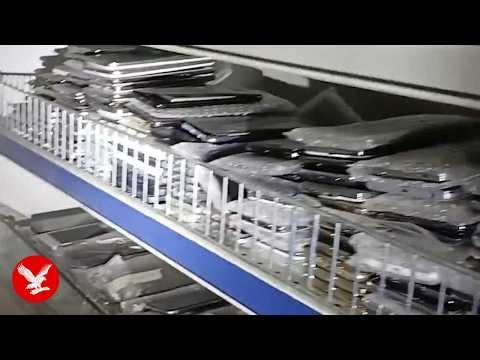 Moment police raid north London shop to find over 1000 suspected stolen phones