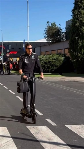 Toto Wolff arrives in his scooter in the Madring Paddock