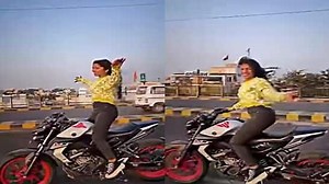 Viral video: Girl dances to trending Bhojpuri song Patli Kamariya while riding bike, netizens upset- WATCH