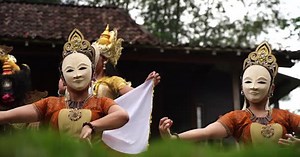 Masked Dancers Performing Traditional Dance in Rural Setting