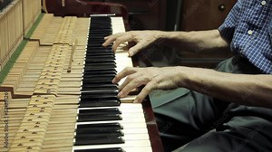 Piano Tuning, Repair and Maintenance, An Elderly Man Tuning an Old Piano at his Workshop. Close Up. 4K Resolution.