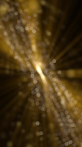 Download Vertical video - golden glitz and glamour background animation with flowing glittering gold bokeh particles and shimmering light rays. This glitzy motion background is full HD and a seamless loop for free