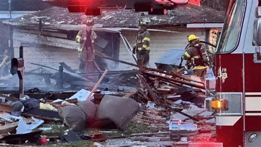 Woman killed after house explodes, police say