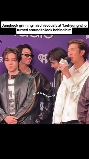 Jungkook grinning mischievously at Taehyung who turned around to look behind him#taekook #shortvideo