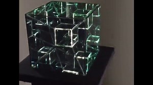 A hypercube 4th dimension infinity mirror art sculpture.