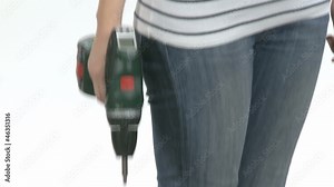 Young craftswoman with a power drill