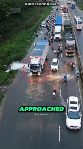 Truck Driver Blocks Water Burst to Help Traffic