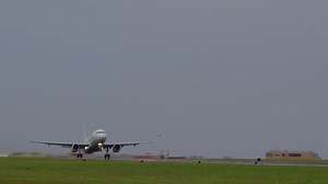 Airplane taking off from airport runway Premium Stock Video Footage