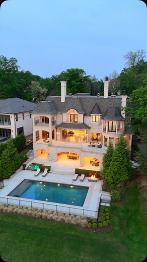 Step inside this French Chateau-inspired estate on the calm side of Cass Lake in West Bloomfield, Michigan. Over 11,000 sqft of luxury across three levels, connected by a private elevator. Enjoy panoramic views, smart home tech, a pool, spa, and everything that comes with the lake life dream. Agent: @realtysolutionsofmi Architect: @corey_campbell_architect Builder: @trademarkbuildingmichigan #luxuryrealestate #michigan #mansion #lakehouse #backyard #pool | WayUp Media