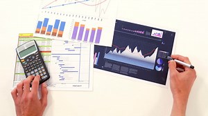 Man hand calculating the graph | Premium Stock Video Footage