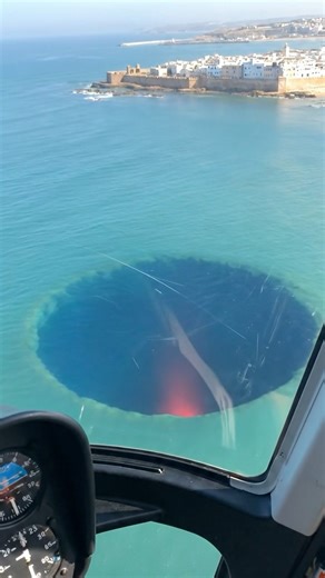 A massive hole beneath the ocean surface, now revealing a deep red light glowing from below 🌊🔴 Natural phenomenon, hidden structure, or something far more unsettling? The scene feels almost Stranger Things–like… where the ocean itself looks torn open, exposing something that was never meant to be seen. What do you think is down there? #StrangerThings #fblifestyle #Earthimpacts #moon #nightsky #astronomy #moonphase #stargazing #news #space #jobs #localcommunity #backtoschool | Earth Impacts