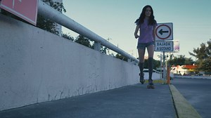 Slowly skating down a concrete sidewalk - Free Stock Video