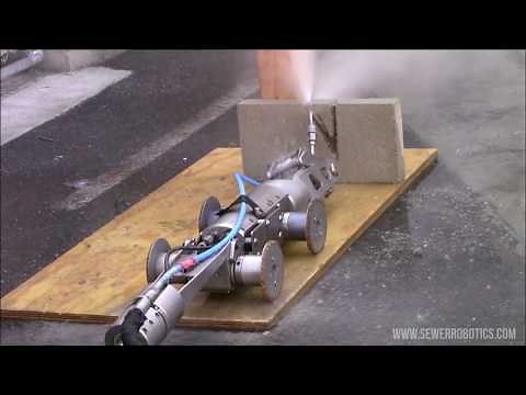 Water jet robot cuts through cement to demonstrate sewer blockage removal