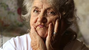 Elderly woman surprised face and opened mouth