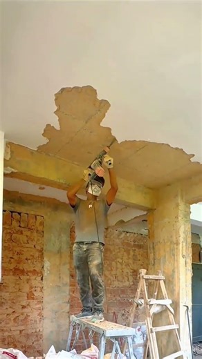 Removing Old Ceiling Plaster with a Jackhammer for a Clean and Smooth Renovation Project