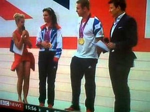 Wind blows reporters dress up at paralympic ceremony