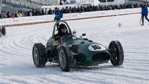 Classic Aston Martin and Ferrari F1 cars racing on ice