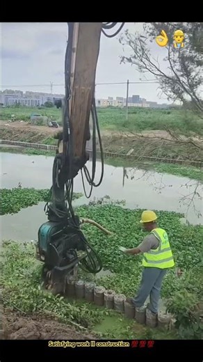 Excavator working on embankment : Building a strong embankment to prevent erosion
