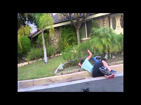 Stupid Kid falls off bike going downhill